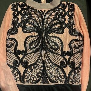 Women’s 2X sequin bodysuit in light pink / peach